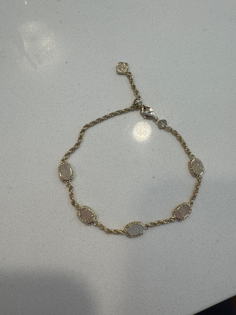 Kendra Scott Gold Bracelet with Pale Pink Stone Accents